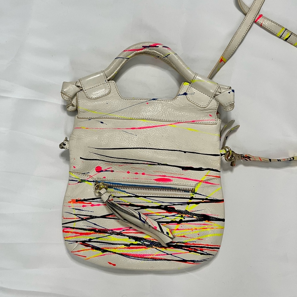 Foley + Corinna cross body bag. Magnetic closure and folds over